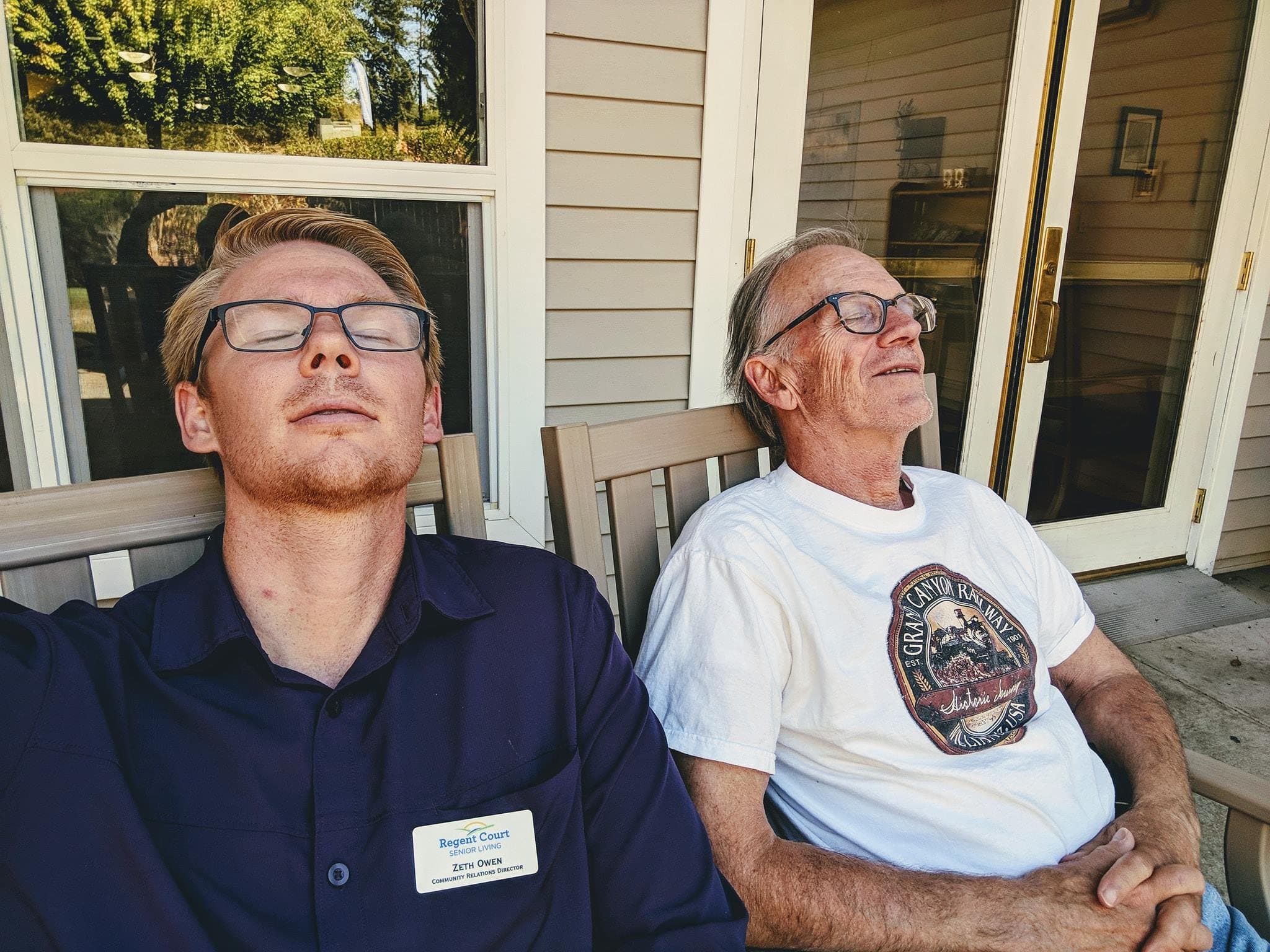 Zeth Owen as Community Relations Director at Regent Court Senior Living, relaxing with a resident