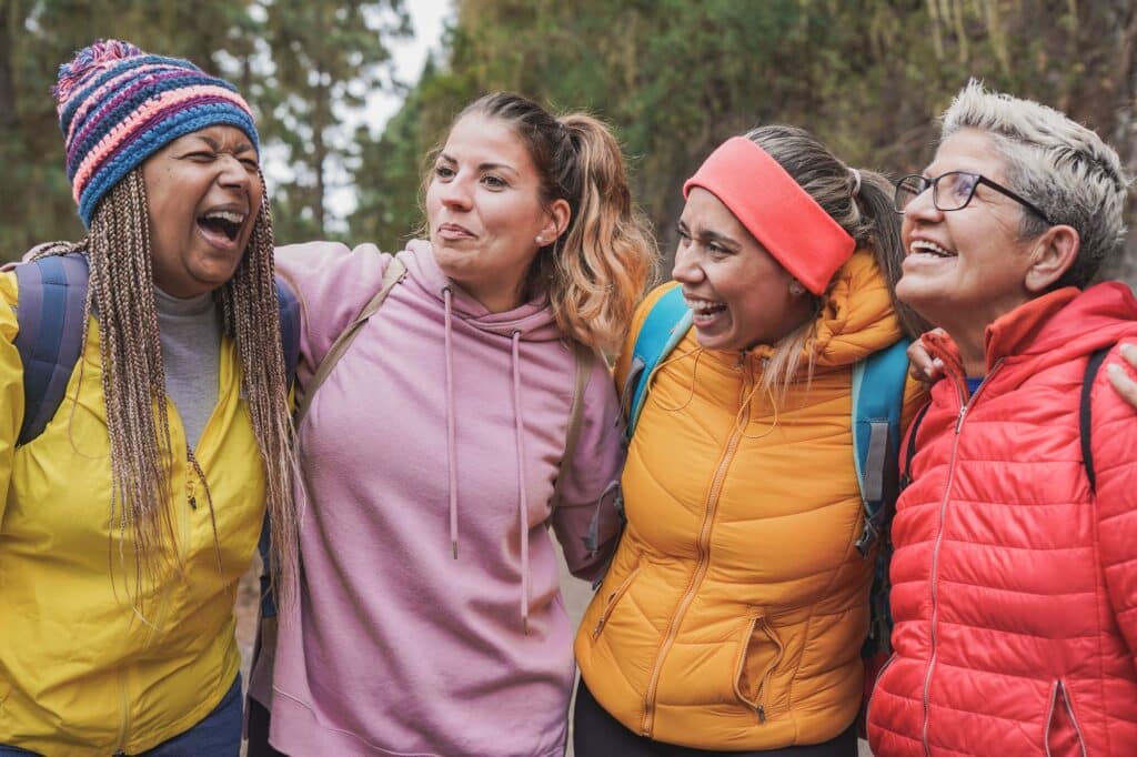 Multiracial women with different generation enjoy trekking day in the nature